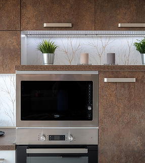 A contemporary kitchen with warm wood cabinetry